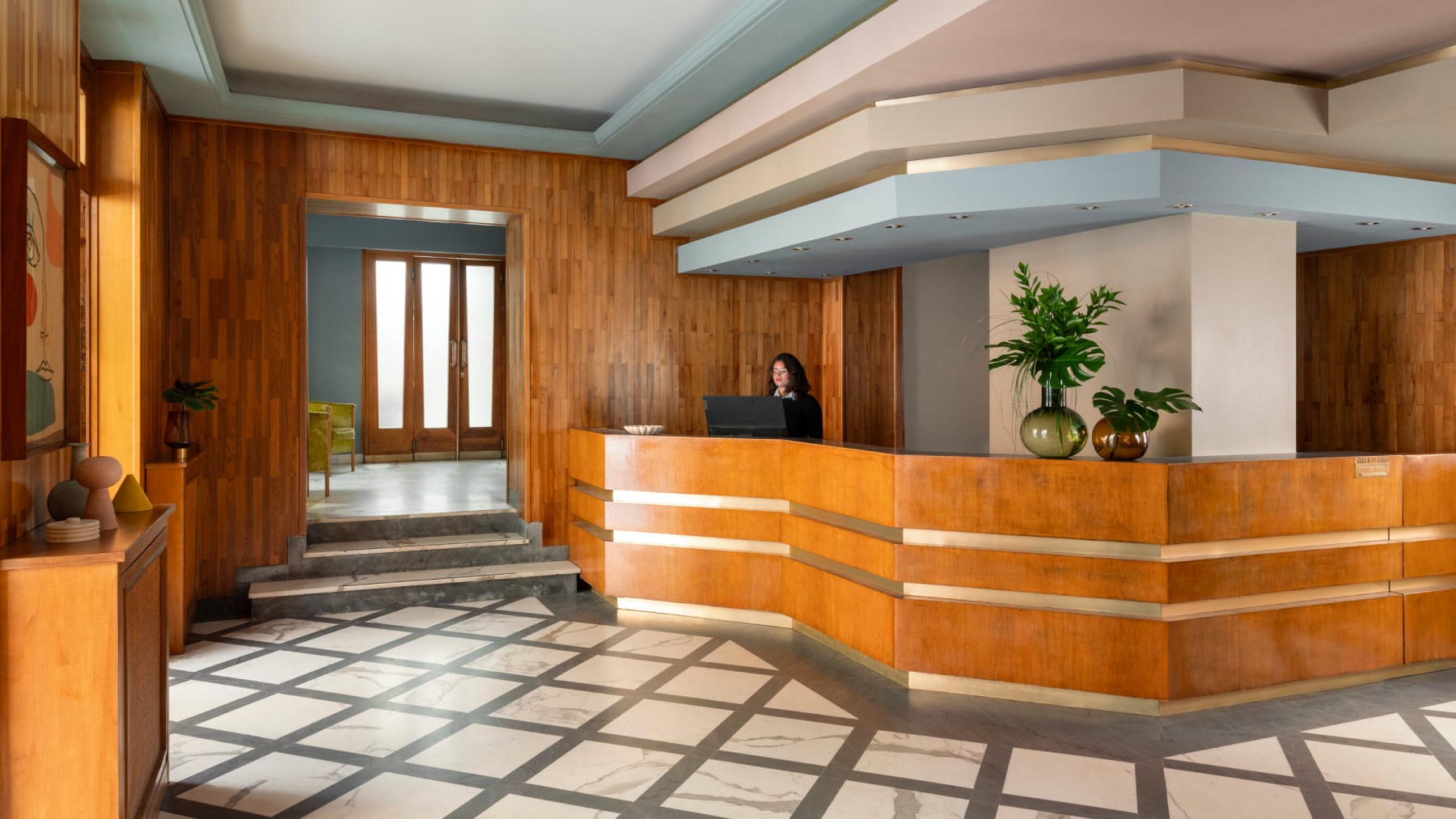 Vintage hotel reception with wooden counter and geometric marble floor - Hotel Milani, BZAR hotels in Rome